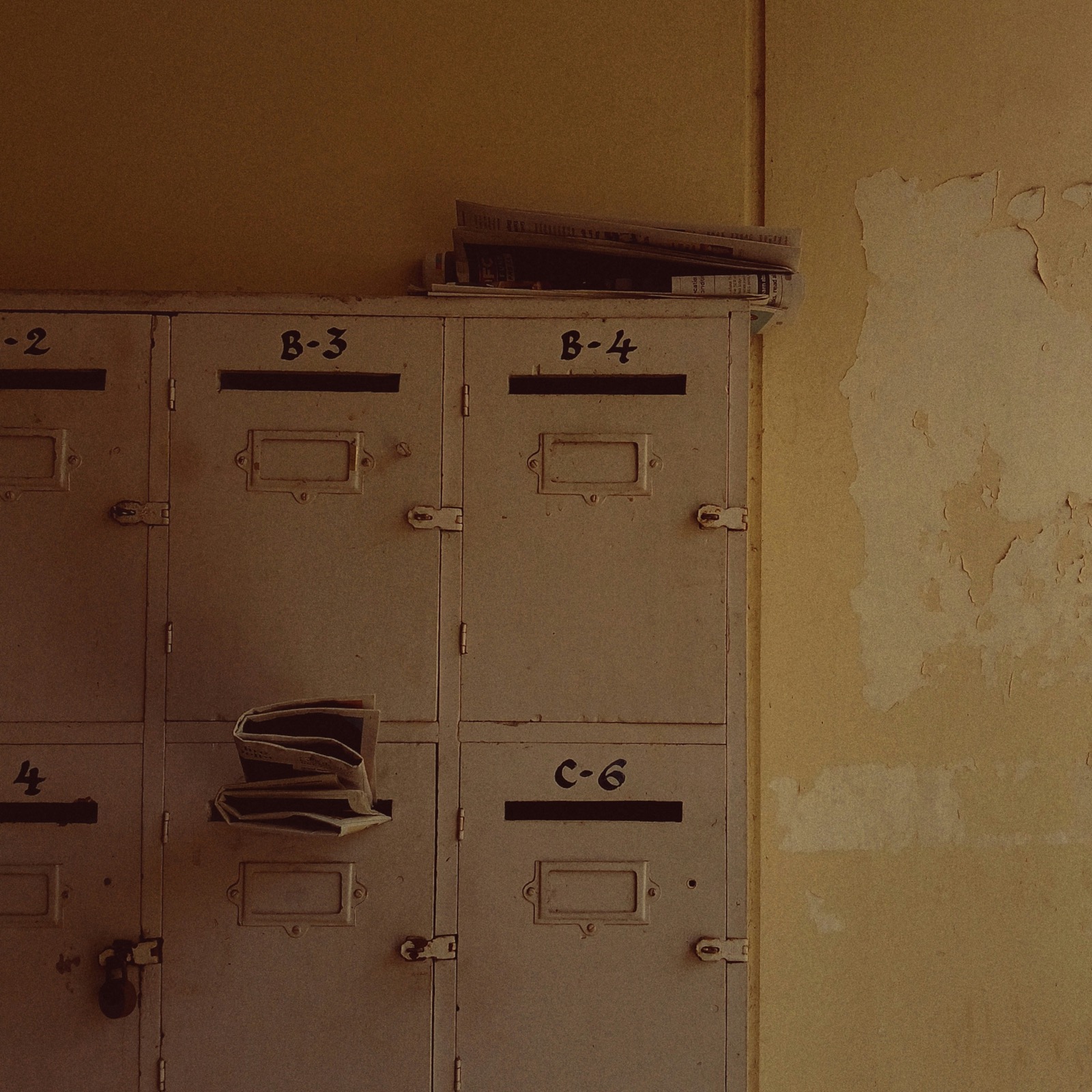 a wall of vintage labeled mail slots